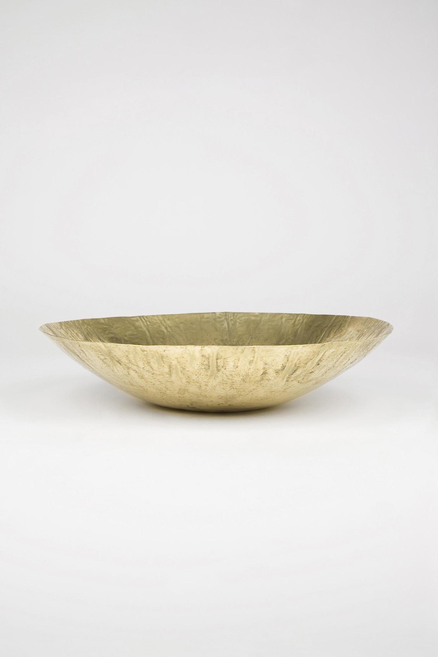 Side view of GoldenDish brass bowl showing shallow shape and minimalist design”